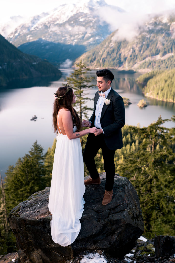 couple on cliffside for adventure elopement
